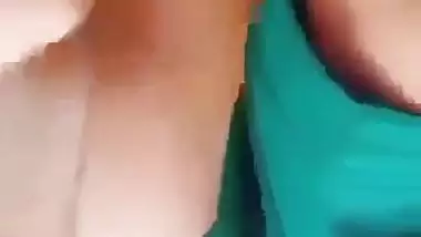 Horny girl squeezes her boobs and fingers her hairy pussy