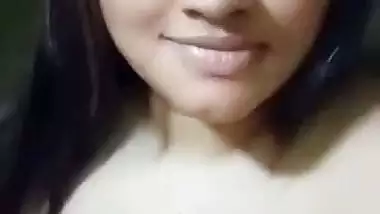 Cute girl opens bra to show sexy boobs to lover