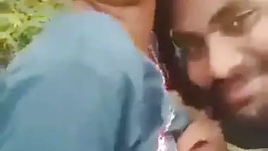 Indian outdoor sex of a guy sucking his GF’s tight boobs