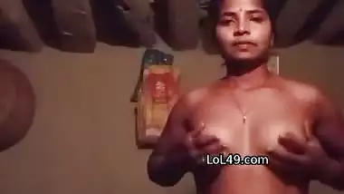 Village girl stripping and playing with bouncing boobs